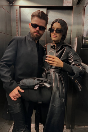 iLo in a black leather Matrix-style costume